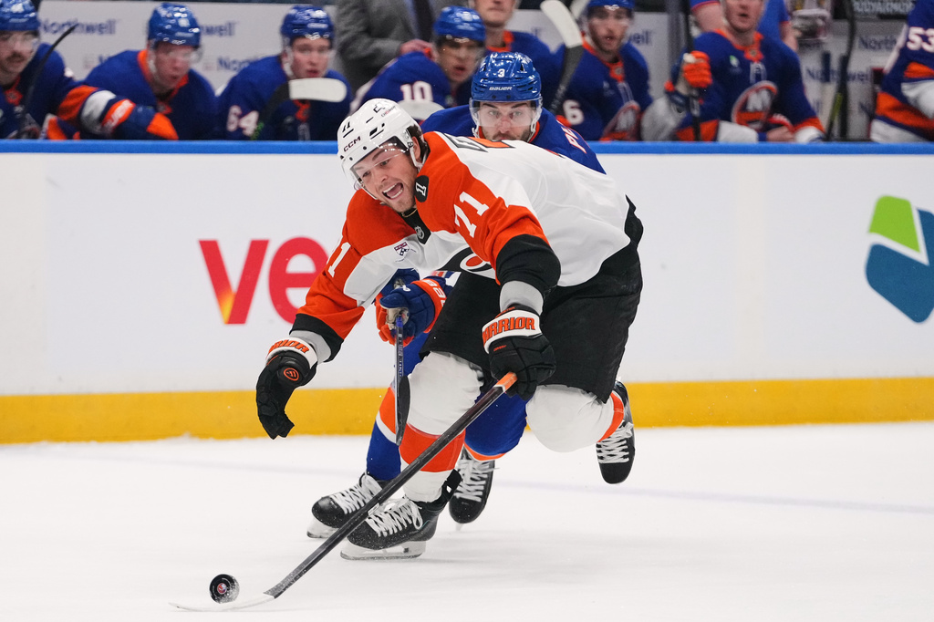 Philadelphia Flyers' Tyson Foerster (71) deke pastNew York Islanders' Adam Pelech (3) during the first period of an NHL hockey game Friday, April 3, 2026, in Elmont, N.Y. (AP Photo/Frank Franklin II)