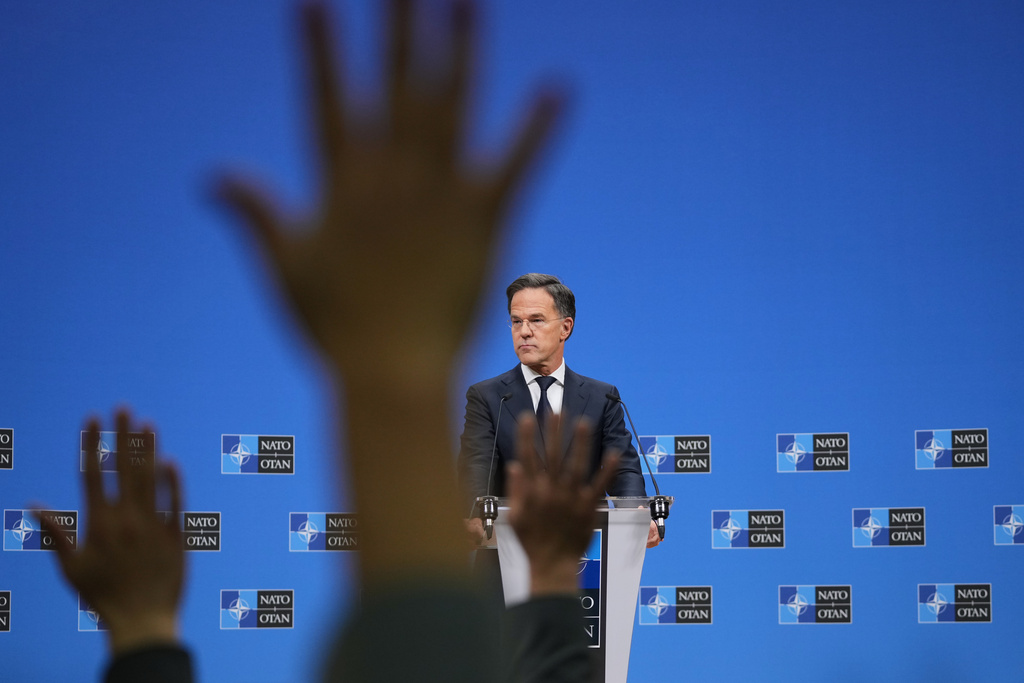 NATO Secretary General Mark Rutte takes questions from journalists during a pre-ministerial media conference at NATO headquarters in Brussels, Tuesday, Dec. 2, 2025. (AP Photo/Virginia Mayo)