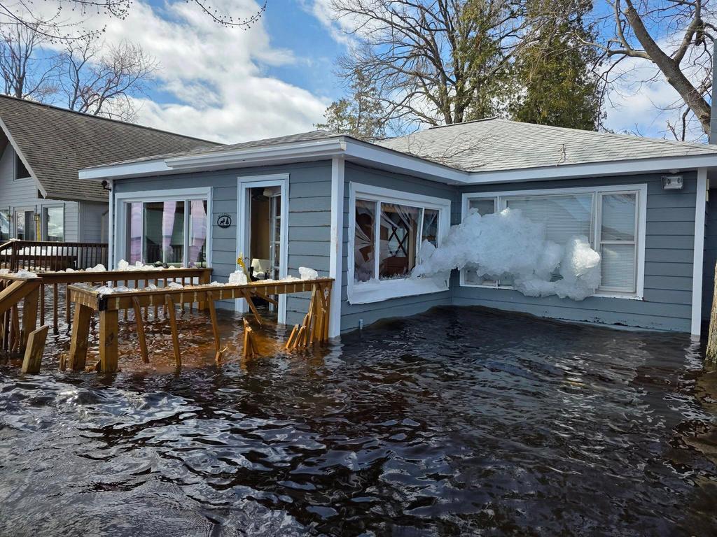 This image provided by Christopher Narsesian shows chunks of ice and flooding in Michigan’s Black Lake in the northeastern Lower Peninsula on April 19, 2026. (Christopher Narsesian via AP)
