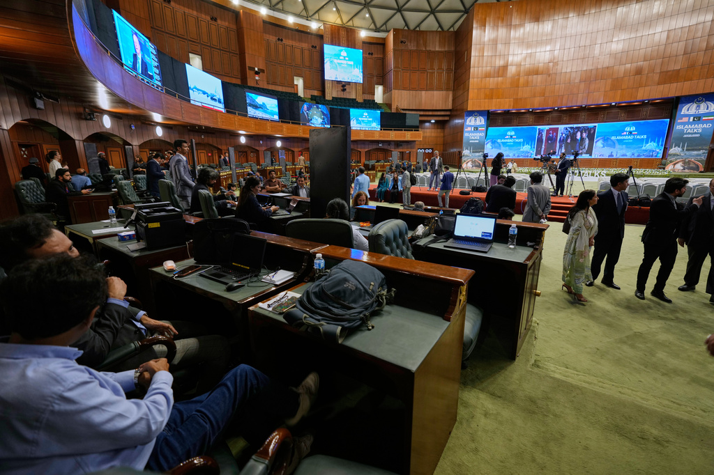 Members of the media work at a media center setup for the coverage of the US-Iran talks, in Islamabad, Pakistan, Saturday, April 11, 2026. (AP Photo/Anjum Naveed)