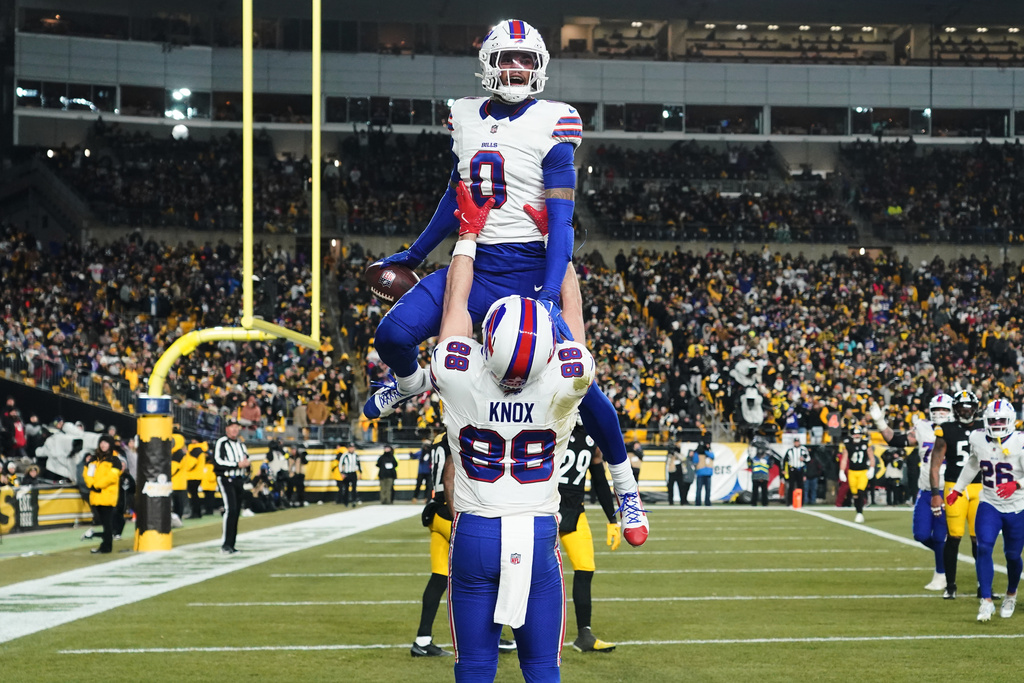 Buffalo Bills wide receiver Keon Coleman (0) celebrates with tight end Dawson Knox (88) after a touchdown during the second half of an NFL football game against the Pittsburgh Steelers Sunday, Nov. 30, 2025, in Pittsburgh.(AP Photo/Matt Freed)