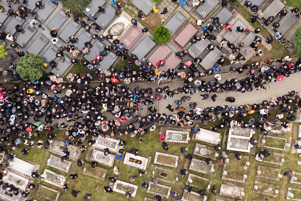 Thousands of people attend the funeral of popular Bosnian folk singer Halid Beslic, who also was also widely known for his humanitarian work during and after the country's bloody 1992-95 war, in Sarajevo, Bosnia, Monday, Oct. 13, 2025. (AP Photo/Armin Durgut)