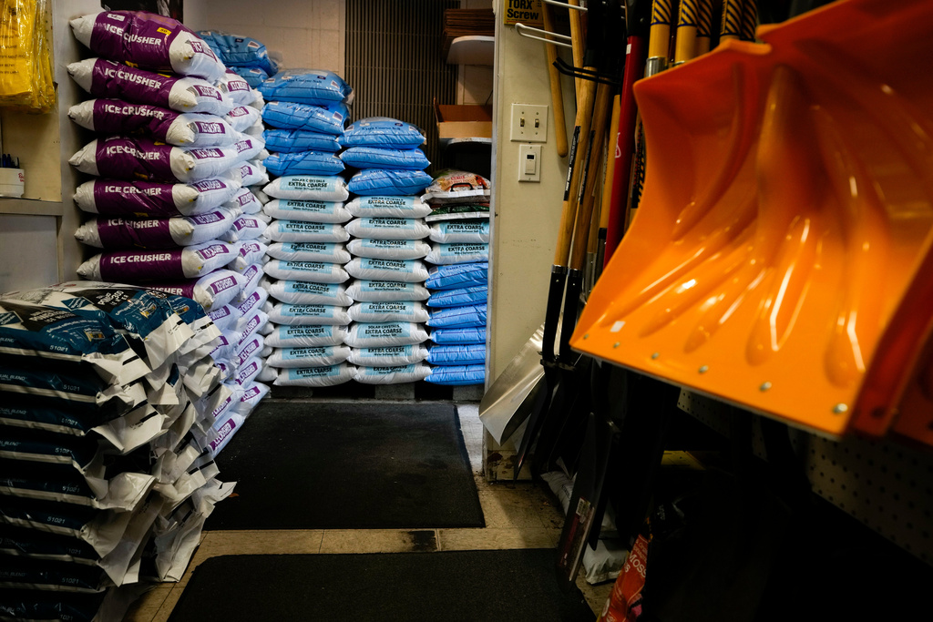 FILE - Salt and shovels are displayed for sale at Ankeny Hardware, Jan. 11, 2024, in Portland, Ore. (AP Photo/Jenny Kane, File)