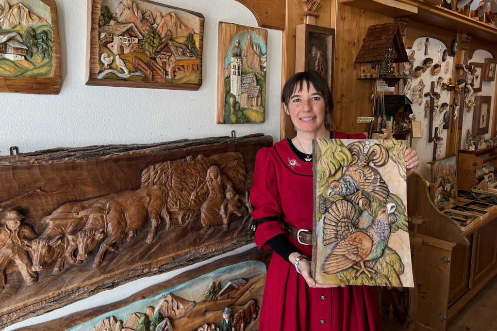 Jasmine Feuchter poses for a photo in a traditional craft shop in San Vigilio di Marebbe, northern Italy, Monday, Jan. 26, 2026. (AP Photo/Nicole Winfield)