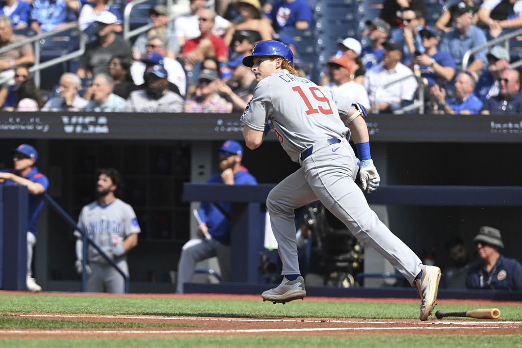 Chicago Cubs' Owen Caissie (19), making his major league debut, flies out against the Toronto Blue Jays during a baseball game, Thursday, Aug. 14, 2025, in Toronto. (Jon Blacker/The Canadian Press via AP)
