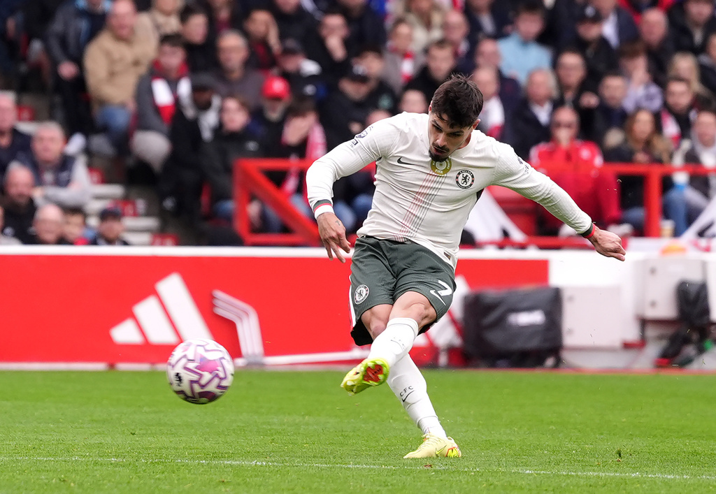 Chelsea's Pedro Neto scores his side's second goal of the game, during the English Premier League soccer match between Nottingham Forest and Chelsea, in Nottingham, England, Saturday, Oct. 18, 2025. (Bradley Collyer/PA via AP)