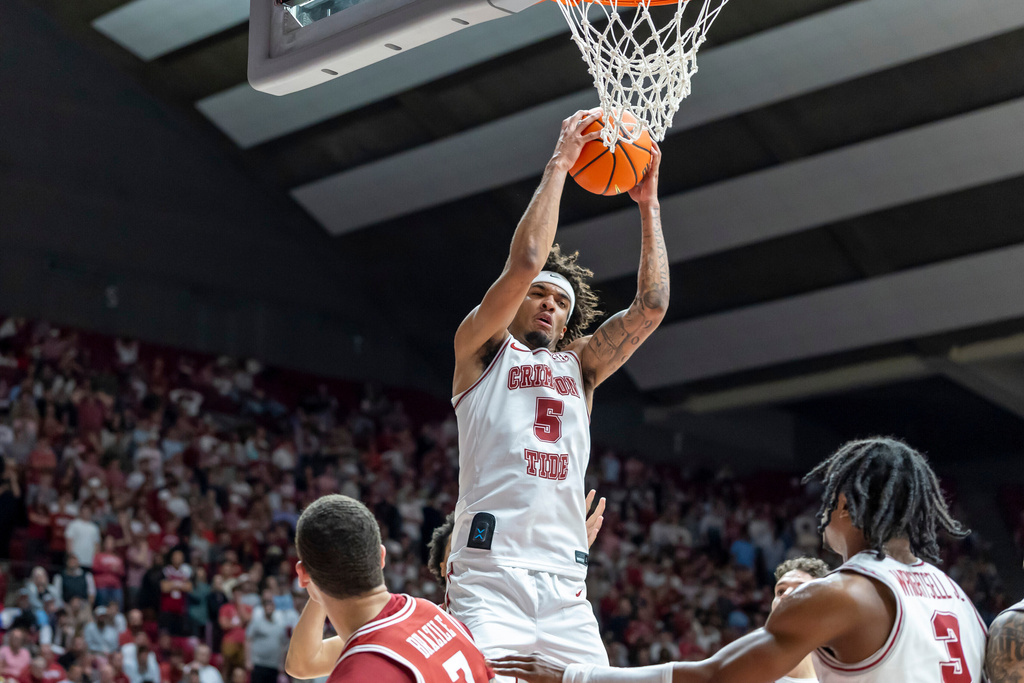 Alabama forward Amari Allen (5) grabs a rebound against Arkansas during the first half of an NCAA college basketball game Wednesday, Feb. 18, 2026, in Tuscaloosa, Ala. (AP Photo/Vasha Hunt)