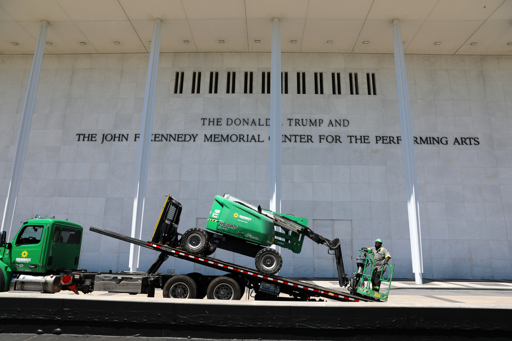 A worker loads equipment on a flatbed truck outside The John F. Kennedy Center for the Performing Arts, Thursday, June 4, 2026, in Washington. (AP Photo/Rahmat Gul)