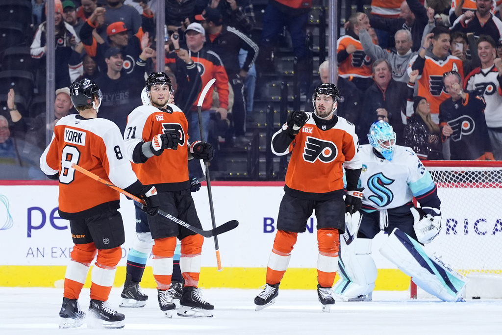 Philadelphia Flyers' Tyson Foerster (71) celebrates with teammates after scoring a goal during the first period of an NHL hockey game against the Seattle Kraken Monday, Oct. 20, 2025, in Philadelphia. (AP Photo/Matt Slocum)