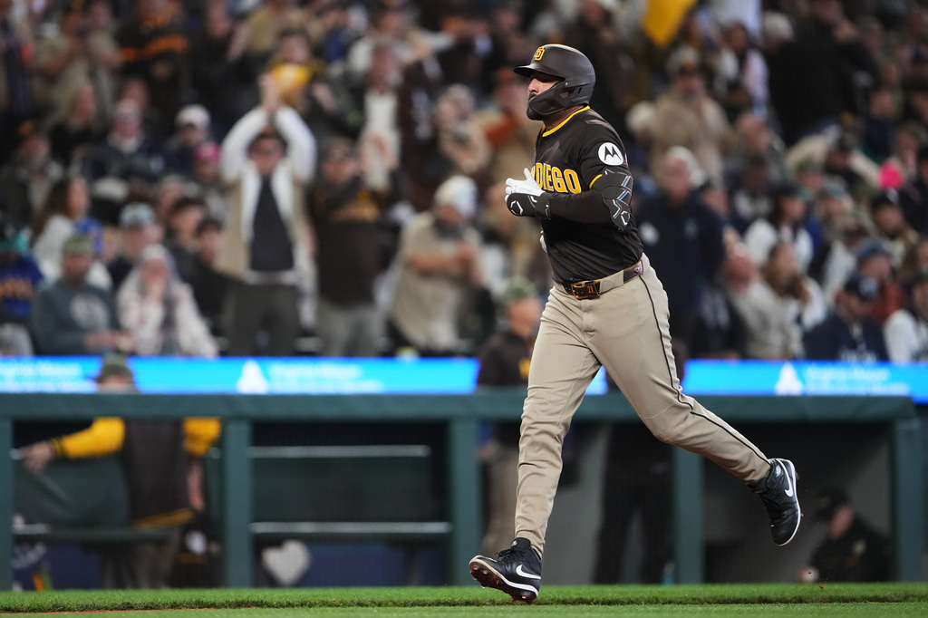 San Diego Padres' Nick Castellanos jogs home after hitting a three-run home run against the Seattle Mariners during the fourth inning of a baseball game, Saturday, May 16, 2026, in Seattle. (AP Photo/Lindsey Wasson)