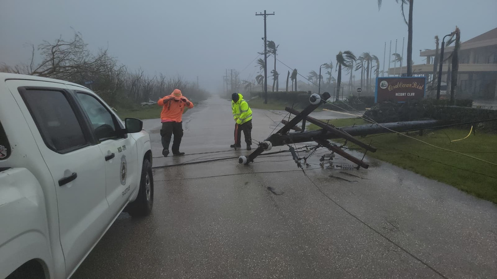A utility pole blocks the road in Saipan on Wednesday, April 15, 2026, as a super typhoon with ferocious winds and relentless rains, shredded tin roofs and forced residents to take cover from flying tree limbs. (Office of the Mayor, municipality of Saipan via AP)