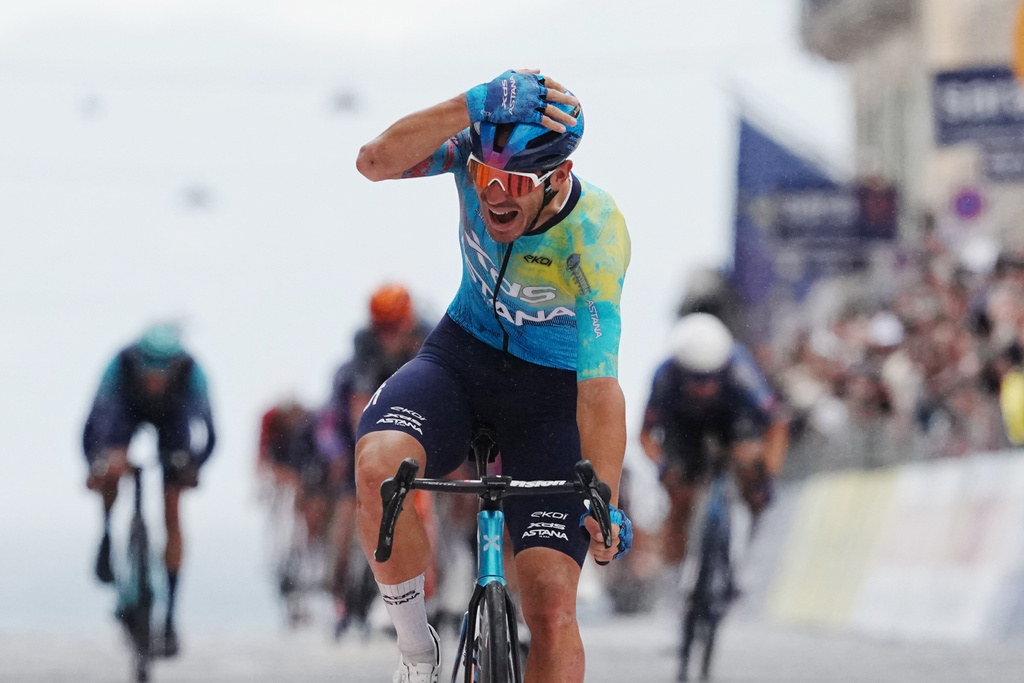 Italy's Davide Ballerini celebrates winning the 6th stage of the Giro d'Italia cycling race, from Paestum to Naples, Italy, Thursday, May 14, 2026. (Gian Mattia d'Alberto/LaPresse via AP)