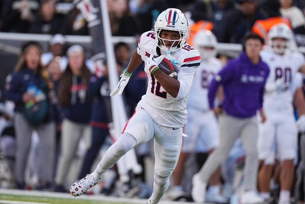 Arizona wide receiver Tre Spivey runs for a touchdown after pulling in a pass in the first half of an NCAA college football game against Colorado, Saturday, Nov. 1, 2025, in Boulder, Colo. (AP Photo/David Zalubowski)