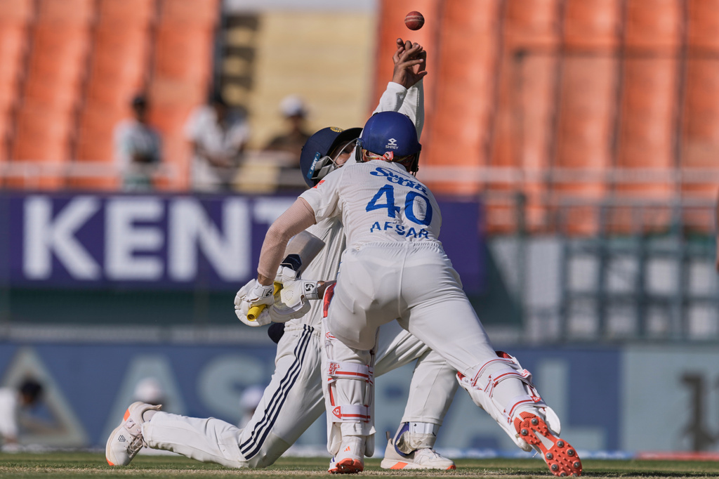 India's Dhruv Jurel fields a shot by Afghanistan's Afsar Zazai on day two of the cricket test match between Afghanistan and India in New Chandigarh, India, Sunday, June 7, 2026. (AP Photo/Ashwini Bhatia)