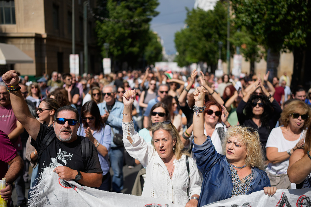 Protesters take part in a nationwide 24-hour strike in Athens, Greece, Wednesday, Oct. 1, 2025, as labor unions demand higher wages and the withdrawal of a bill changing work hours. (AP Photo/Petros Giannakouris)