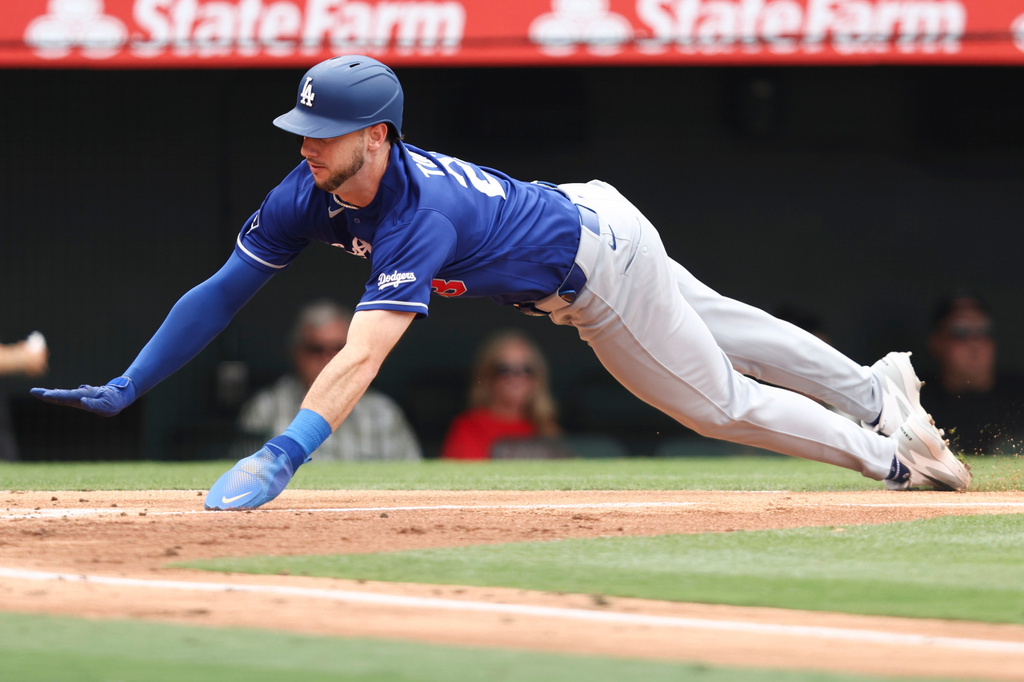 Los Angeles Dodgers' Kyle Tucker slides into home plate to score off of a sacrifice fly by Miguel Rojas during the second of a baseball game against the Los Angeles Angels, Sunday, May 17, 2026, in Anaheim, Calif. (AP Photo/Jessie Alcheh)