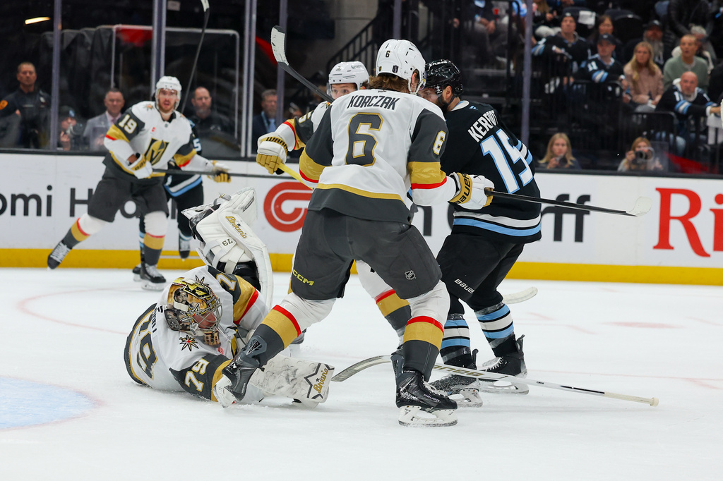 Vegas Golden Knights goalie Carter Hart (79) goes down during the first period of Game 6 in the first round of an NHL hockey Stanley Cup playoff series against the Utah Mammoth, Friday, May 1, 2026, in Salt Lake City. (AP Photo/Melissa Majchrzak)