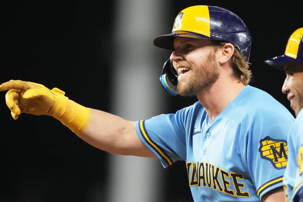 Milwaukee Brewers' Jake Bauers reacts after hitting a single during the tenth inning of a baseball game against the Miami Marlins, Friday, April 17, 2026, in Miami. (AP Photo/Lynne Sladky)