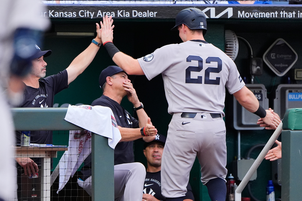 New York Yankees' Ben Rice (22) celebrates in the dugout after scoring on a single by Anthony Volpe during the third inning of baseball game against the Kansas City Royals, Tuesday, May 26, 2026, in Kansas City, Mo. (AP Photo/Charlie Riedel)
