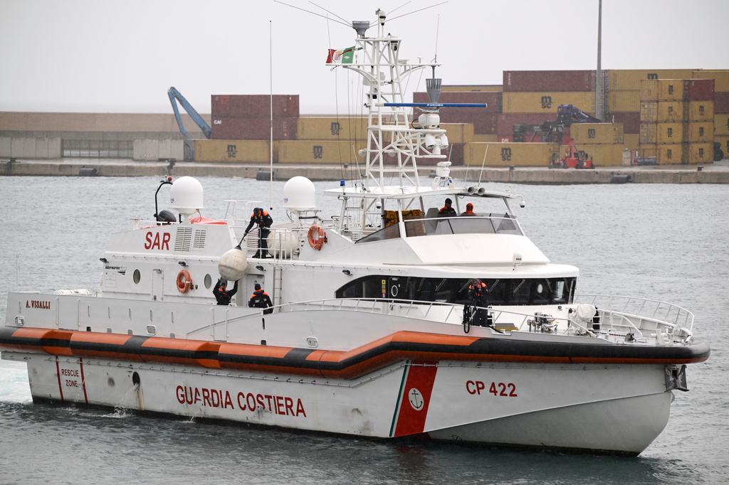 FILE - An Italian Coast Guard ship taking back the first 12 migrants from a newly opened asylum processing center in Shengjin, Albania, arrives in the harbor of Bari, in southern Italy, on Saturday, Oct. 19, 2024. (AP Photo/Valeria Ferraro, file)
