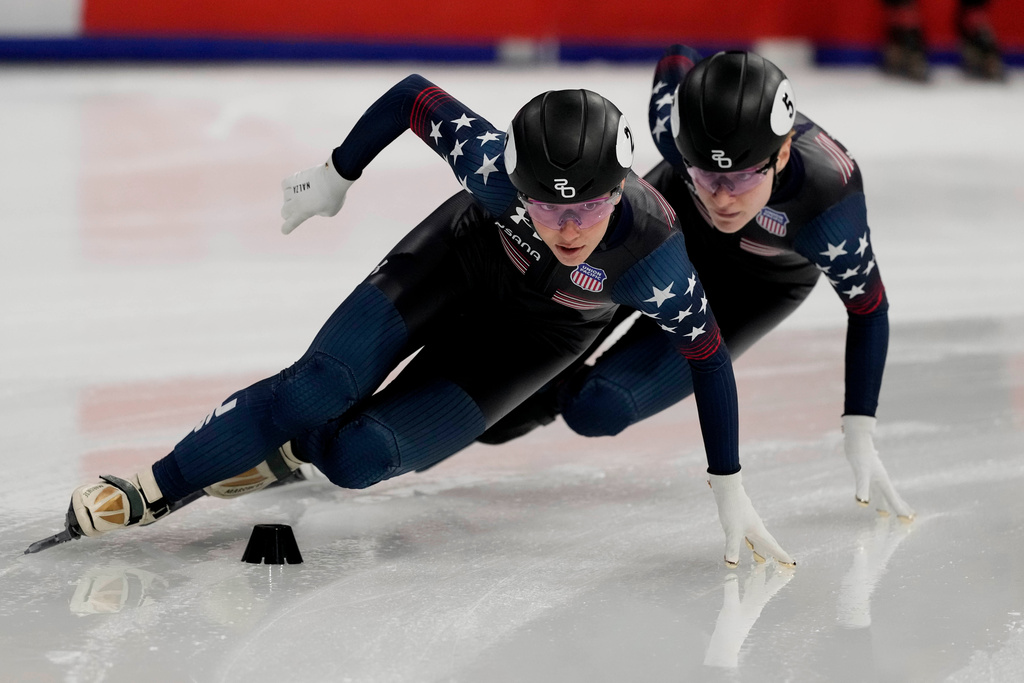 FILE - United States' Kristen Santos-Griswold, gold medal, leads Corinne Stoddard, silver medal, during the women's 1000 meters final of the ISU Short Track World Tour and Olympics Milano-Cortina 2026 test event, in Milan, Italy, Saturday, Feb. 15, 2025. (AP Photo/Luca Bruno, File)
