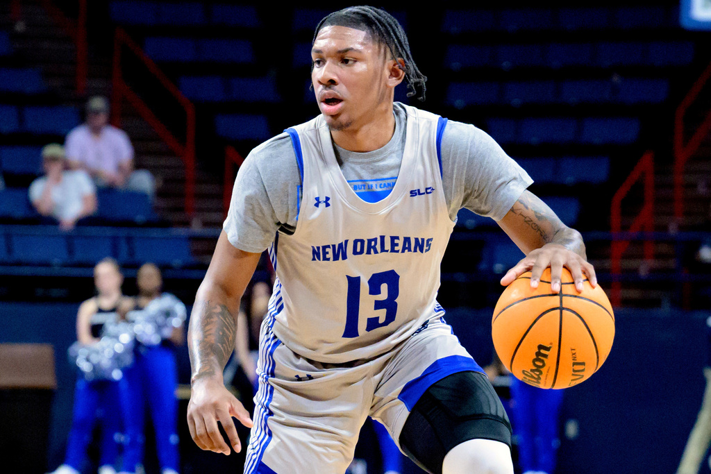 FILE - New Orleans guard Jamond Vincent (13) dribbles during an NCAA college basketball game against McNeese State in New Orleans, Wednesday, March 6, 2024. (AP Photo/Matthew Hinton, File)