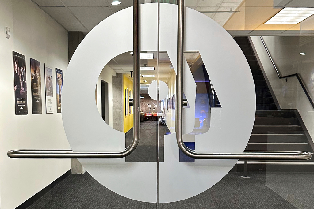 FILE - An entrance to the Arizona PBS offices in the Walter Cronkite School of Journalism and Mass Communication in Phoenix is seen, May 2, 2025. (AP Photo/Katie Oyan, File)