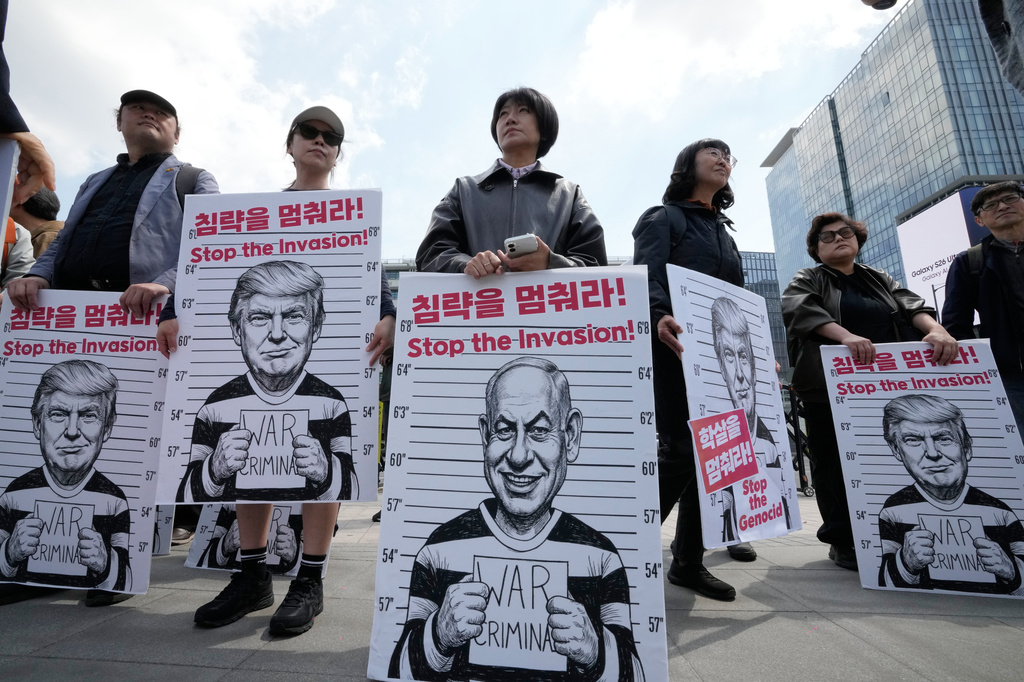 South Korean protesters hold banners depicting U.S. President Donald Trump and Israeli Prime Minister Benjamin Netanyahu during a rally denouncing the U.S. and Israel's attack on Iran, near the U.S. Embassy in Seoul, South Korea, Wednesday, April 29, 2026. (AP Photo/Ahn Young-joon)