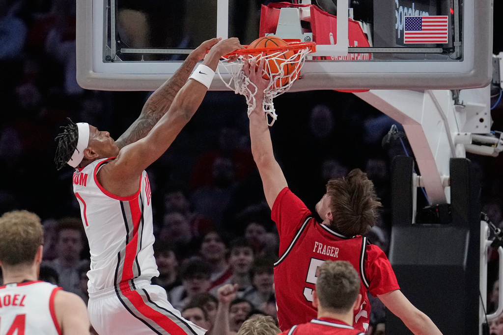 Ohio State forward Amare Bynum, left, dunks over Nebraska forward Braden Frager (5) in the first half of an NCAA college basketball game Monday, Jan. 5, 2026, in Columbus, Ohio. (AP Photo/Sue Ogrocki)