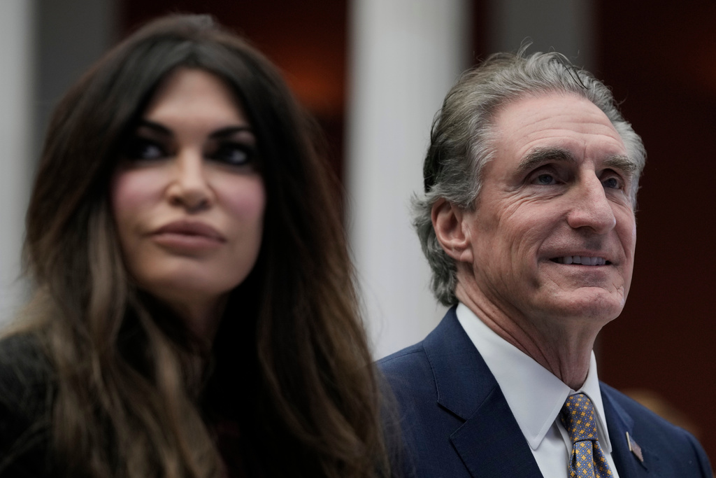 U.S. Interior Secretary Doug Burgum, Secretary, right, and U.S. Ambassador to Greece Kimberly Guilfoyle attend the Atlantic Council conference in Athens, Greece, Thursday, Nov. 6, 2025. (AP Photo/Thanassis Stavrakis)