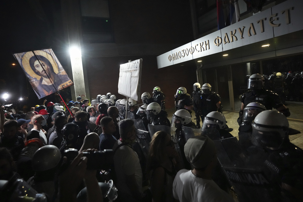Serbian riot police guard Faculty of Philosophy during a protest against increasing police brutality in the northern Serbian city of Novi Sad, Friday, Sept. 5, 2025. (AP Photo/Darko Vojinovic)