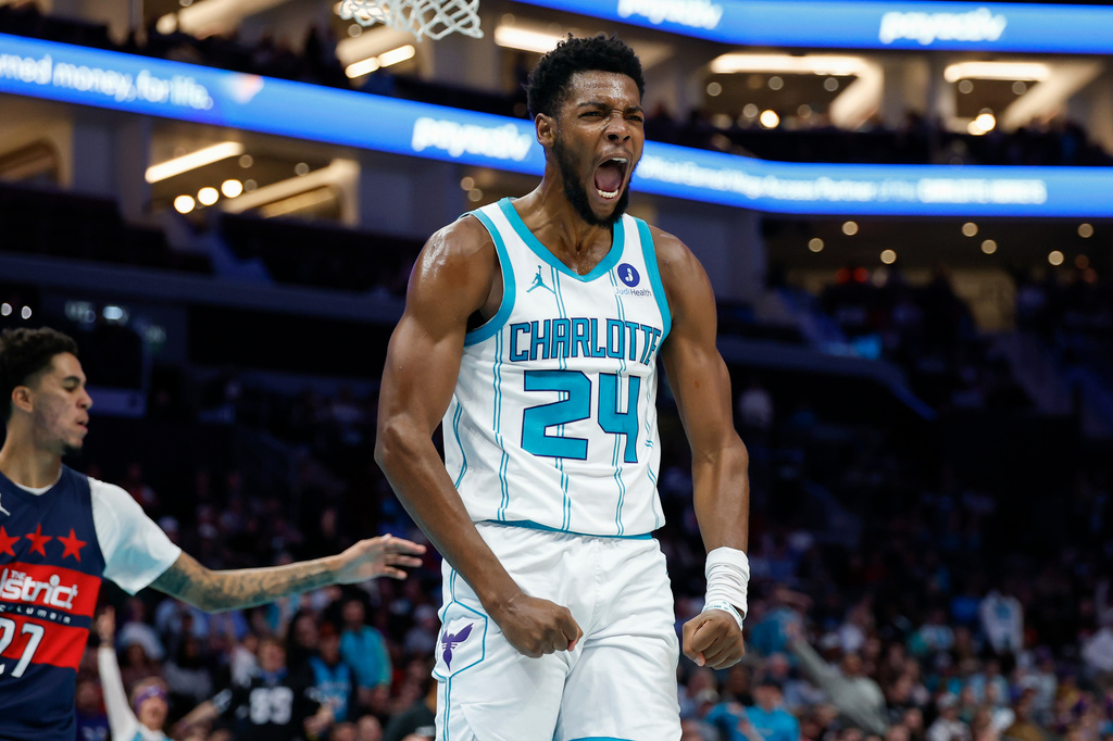 Charlotte Hornets forward Brandon Miller reacts after dunking against the Washington Wizards during the first half of an NBA basketball game in Charlotte, N.C., Monday, Oct. 26, 2026. (AP Photo/Nell Redmond)