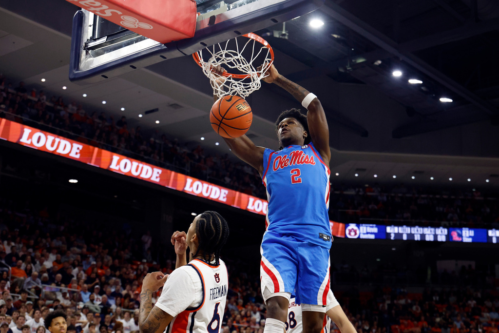 Mississippi guard AJ Storr (2) dunks the ball against Auburn during the first half of an NCAA college basketball game Saturday, Feb. 28, 2026, in Auburn, Ala. (AP Photo/Butch Dill)