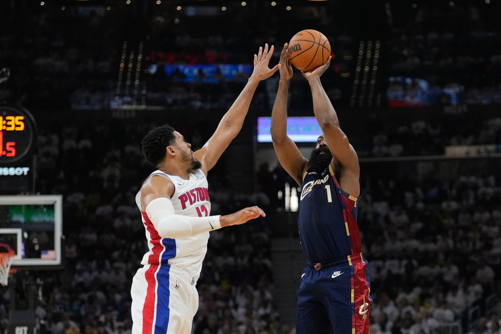 Cleveland Cavaliers guard James Harden (1) shoots as Detroit Pistons forward Tobias Harris (12) defends in the first half of Game 3 of a second-round NBA playoffs basketball series Saturday, May 9, 2026 in Cleveland. (AP Photo/Sue Ogrocki)