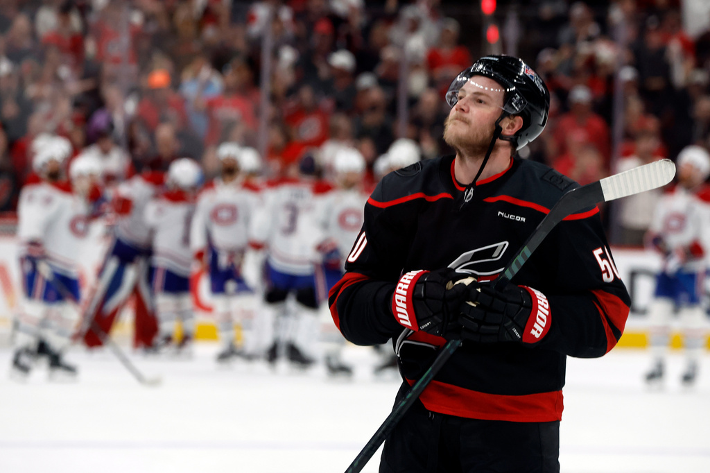 Carolina Hurricanes' Eric Robinson celebrates following Game 5 of the Eastern Conference finals NHL hockey Stanley Cup playoff series against the Montreal Canadiens in Raleigh, N.C., Friday, May 29, 2026. (AP Photo/Karl DeBlaker)