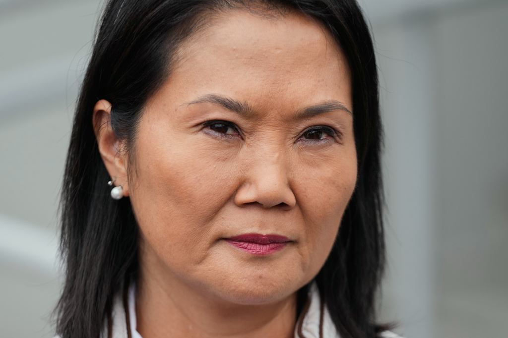 Presidential candidate Keiko Fujimori, of the Popular Force party, listens to a question from a journalist outside her headquarters in Lima, Peru, Friday, June 19, 2026. (AP Photo/Martin Mejia)