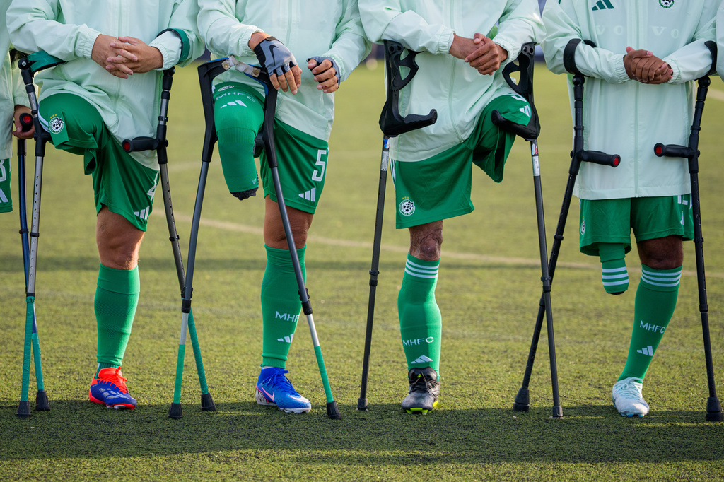Maccabi Haifa's players line up before an amputee soccer match between Maccabi Haifa and Panathinaikos in the inaugural EAFF Conference League in Bucharest, Romania, Thursday, Sept. 24, 2026. (AP Photo/Andreea Alexandru)