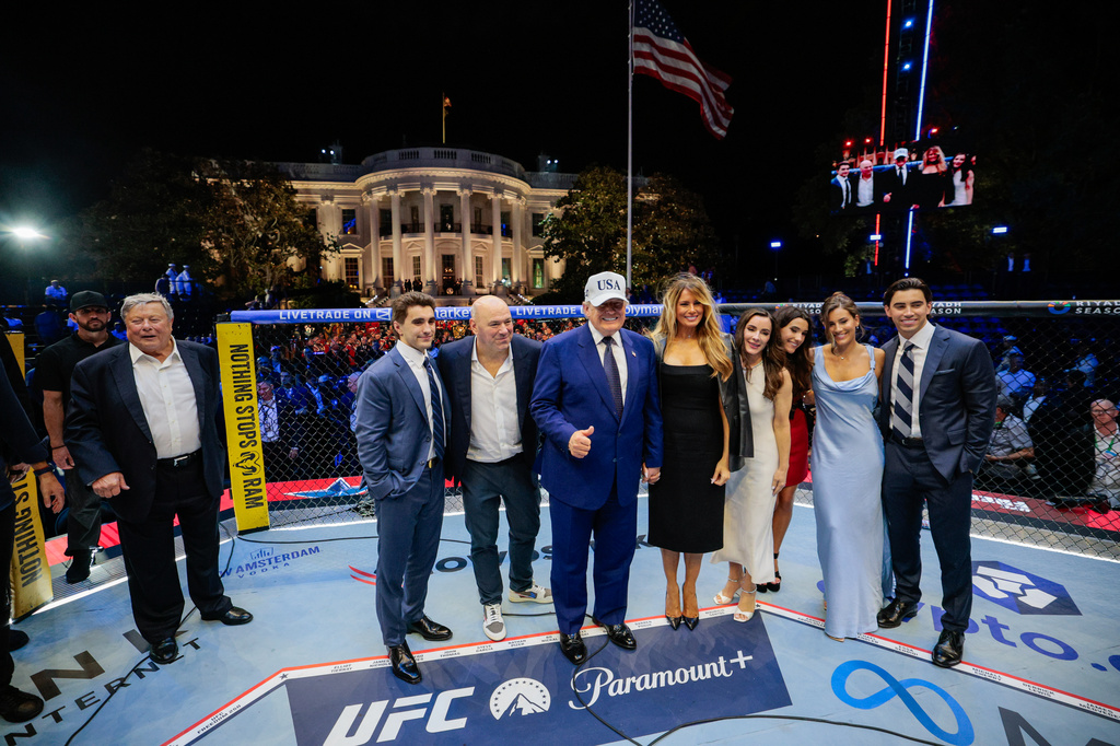 President Donald Trump, first lady Melania Trump, UFC President and CEO Dana White and other guests pose inside the octagon after UFC Freedom 250 on the South Lawn of the White House, Monday, June 15, 2026, in Washington. (Evan Vucci/Pool Photo via AP)