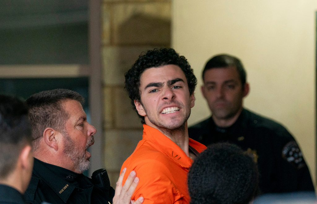 FILE - Suspect Luigi Mangione is taken into the Blair County Courthouse on Tuesday, Dec. 10, 2024, in Hollidaysburg, Pa. (Benjamin B. Braun/Pittsburgh Post-Gazette via AP, File)