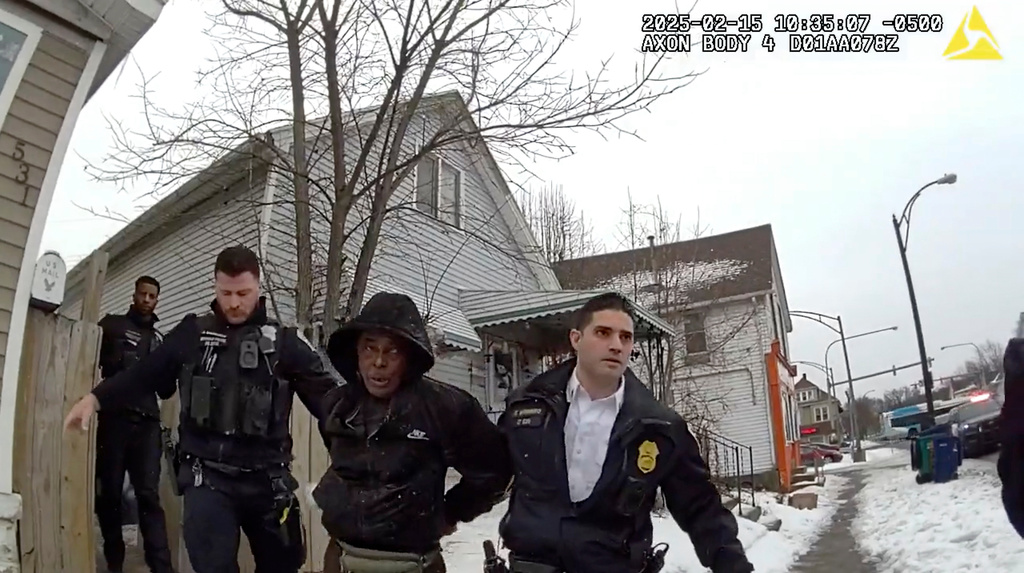 FILE - This image from body camera video provided by the Buffalo Police Department shows Nurul Amin Shah Alam, center, led by Buffalo Police officers, Feb. 15, 2025, in Buffalo, N.Y. (Buffalo Police Department via AP, File)