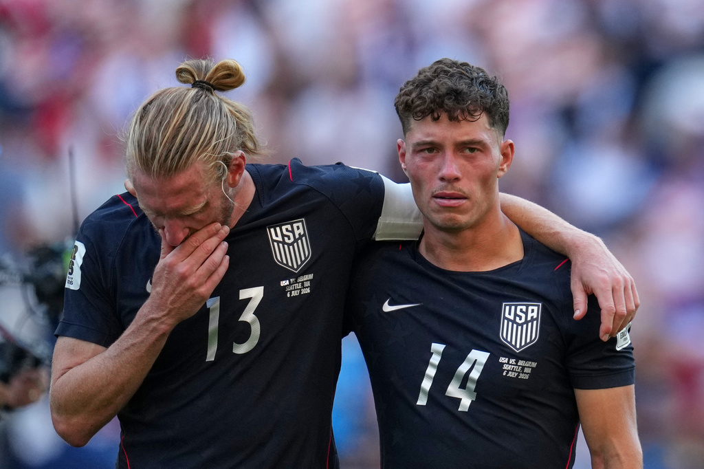United States' Sebastian Berhalter, right, and Tim Ream react after the United States lost a World Cup round of 16 soccer match against Belgium in Seattle, Monday, July 6, 2026. (AP Photo/Abbie Parr)