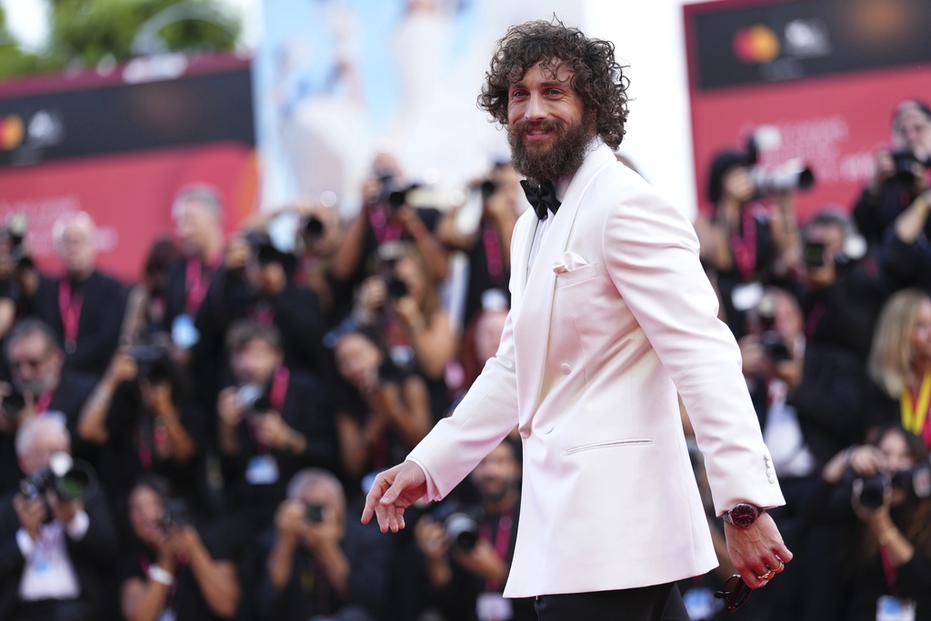 Aaron Taylor-Johnson poses for photographers at the red carpet for the film 'Frankenstein' during the 82nd edition of the Venice Film Festival in Venice, Italy, on Saturday, Aug. 30, 2025. (Photo by Scott A Garfitt/Invision/AP)