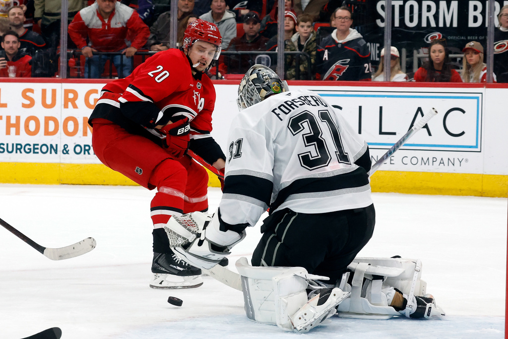 Carolina Hurricanes' Sebastian Aho (20) has his shot blocked by Los Angeles Kings goaltender Anton Forsberg (31) during the second period of an NHL hockey game in Raleigh, N.C., Sunday, Feb. 1, 2026. (AP Photo/Karl DeBlaker)