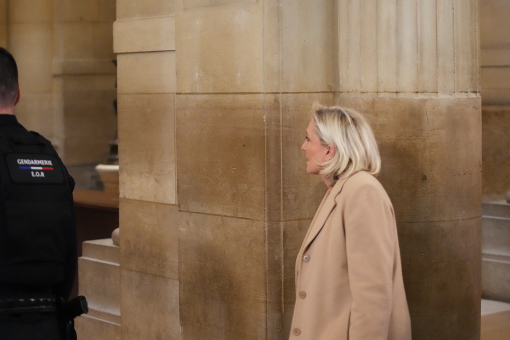 Far-right leader Marine Le Pen arrives for her appeal trial after an embezzlement conviction, Tuesday, Jan. 13, 2026 in Paris. (AP Photo/Christophe Ena)