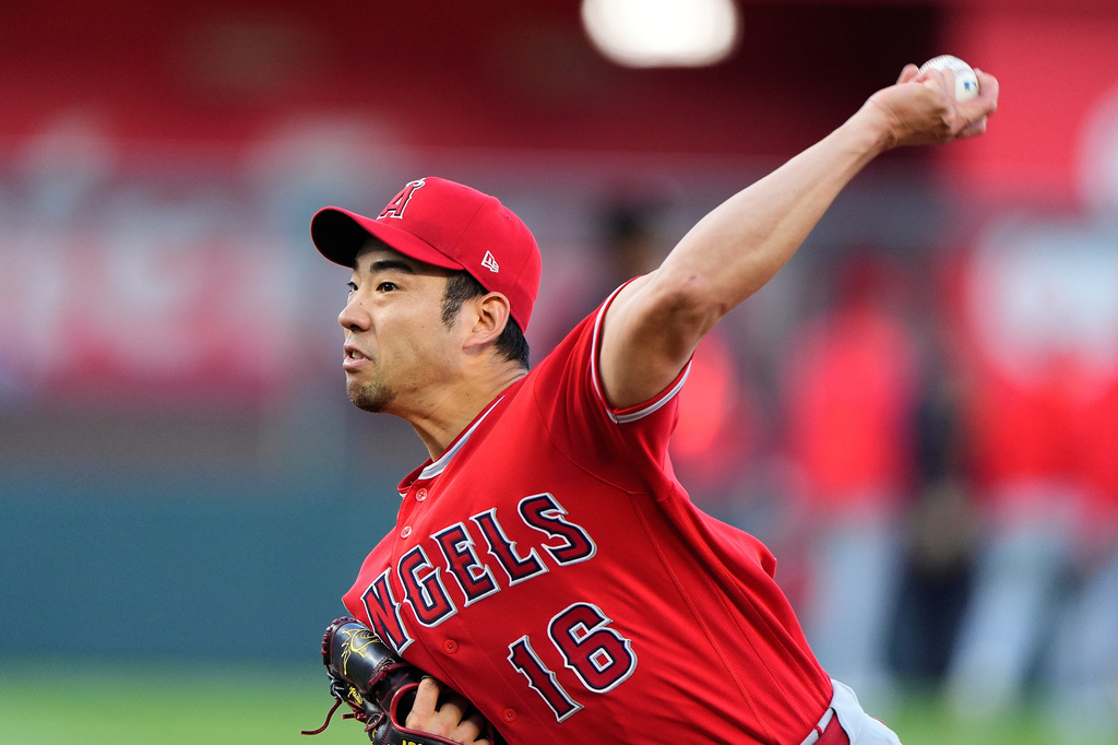 Los Angeles Angels starting pitcher Yusei Kikuchi throws during the first inning of a baseball game against the Kansas City Royals, Friday, April 24, 2026, in Kansas City, Mo. (AP Photo/Charlie Riedel)
