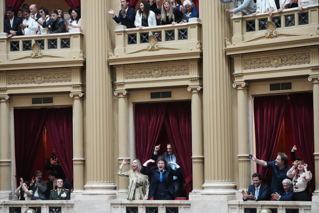 FILE - Argentine President Javier Milei and his sister, General Secretary of the Presidency Karina Milei, cheer for their party's lawmakers during the swearing-in ceremony for newly elected legislators at Congress in Buenos Aires, Argentina, Dec. 3, 2025. (AP Photo/Rodrigo Abd, File)