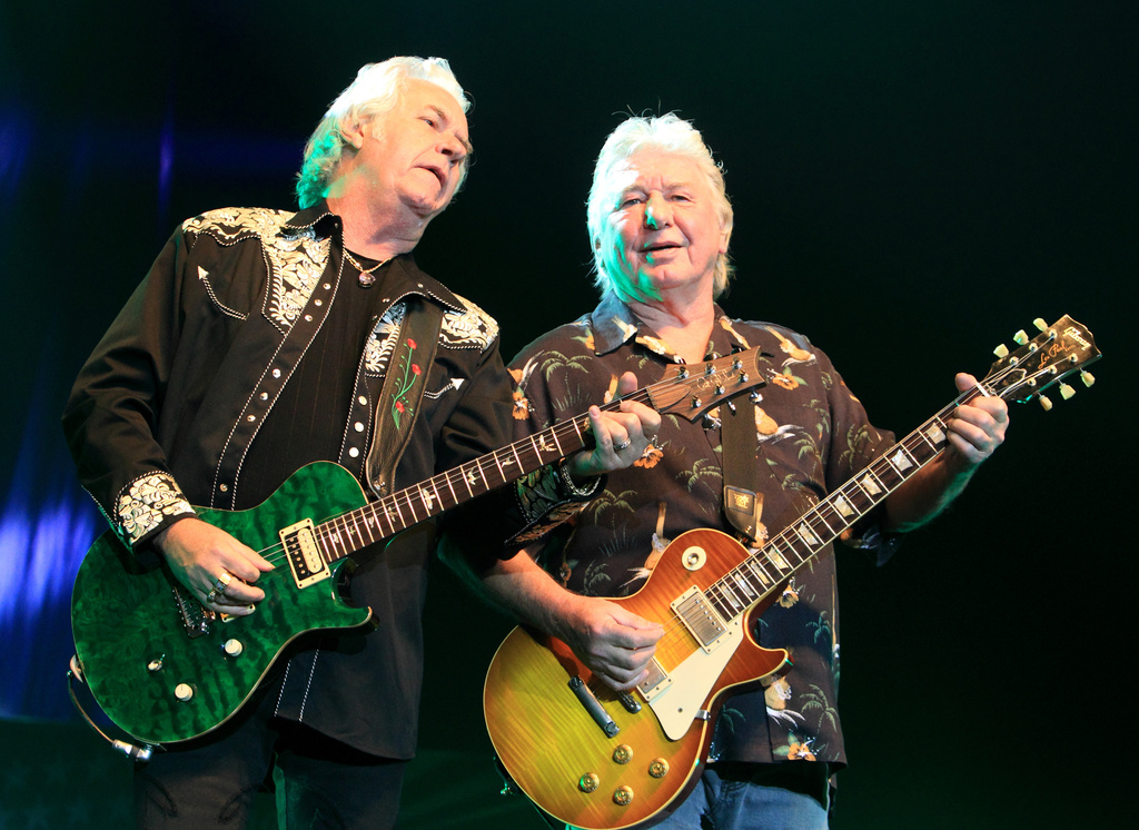 FILE - Howard Leese, left, and Mick Ralphs of the classic rock band Bad Company perform in Bethlehem, Pa., on July 29, 2013. (Photo by Owen Sweeney/Invision/AP, File)
