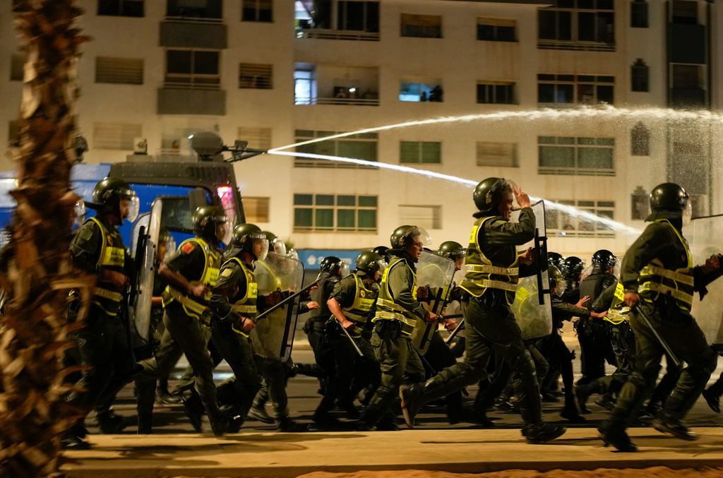 Security forces disperse a gathering as youth led protests calling for healthcare and education reforms turned violent, in Sale, Morocco, Wednesday, Oct. 1, 2025. (AP Photo/Mosa'ab Elshamy)