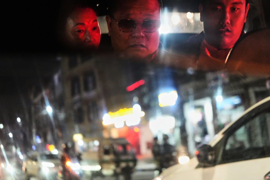 Jalue Dorje, right, and his parents, Dorje Tsegyal, center, Dechen Wangmo, ride a taxi in Kathmandu, Nepal, on Wednesday, April 8, 2026. (AP Photo/Luis Andres Henao)