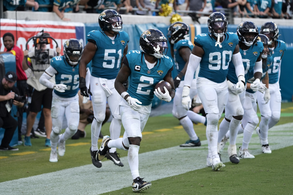 Jacksonville Jaguars cornerback Jourdan Lewis (2) celebrates after intercepting a pass against the Carolina Panthers during the second half of an NFL football game, Sunday, Sept. 7, 2025, in Jacksonville, Fla. (AP Photo/John Raoux)